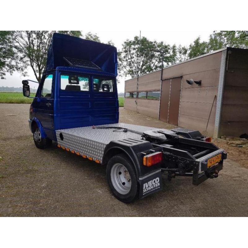 Iveco be combinatie met trailer/oplegger met schuifzijlen